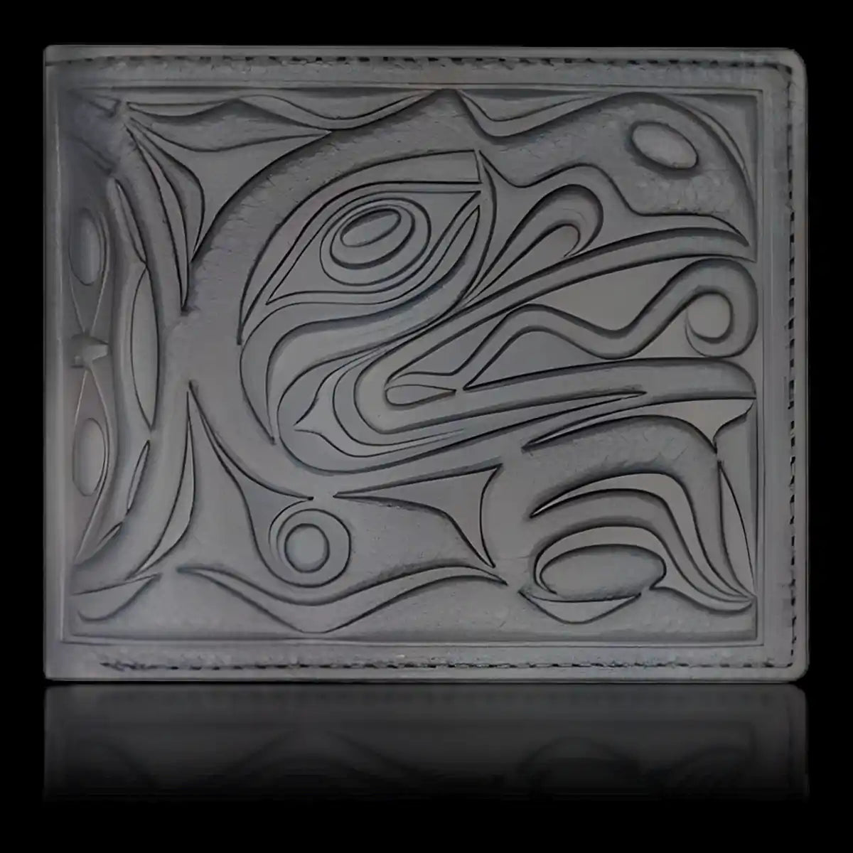 Leather wallet with native embossed raven design